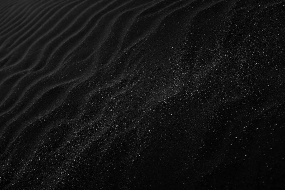 Ornate brass clockwork mechanism against a dramatic sunset horizon