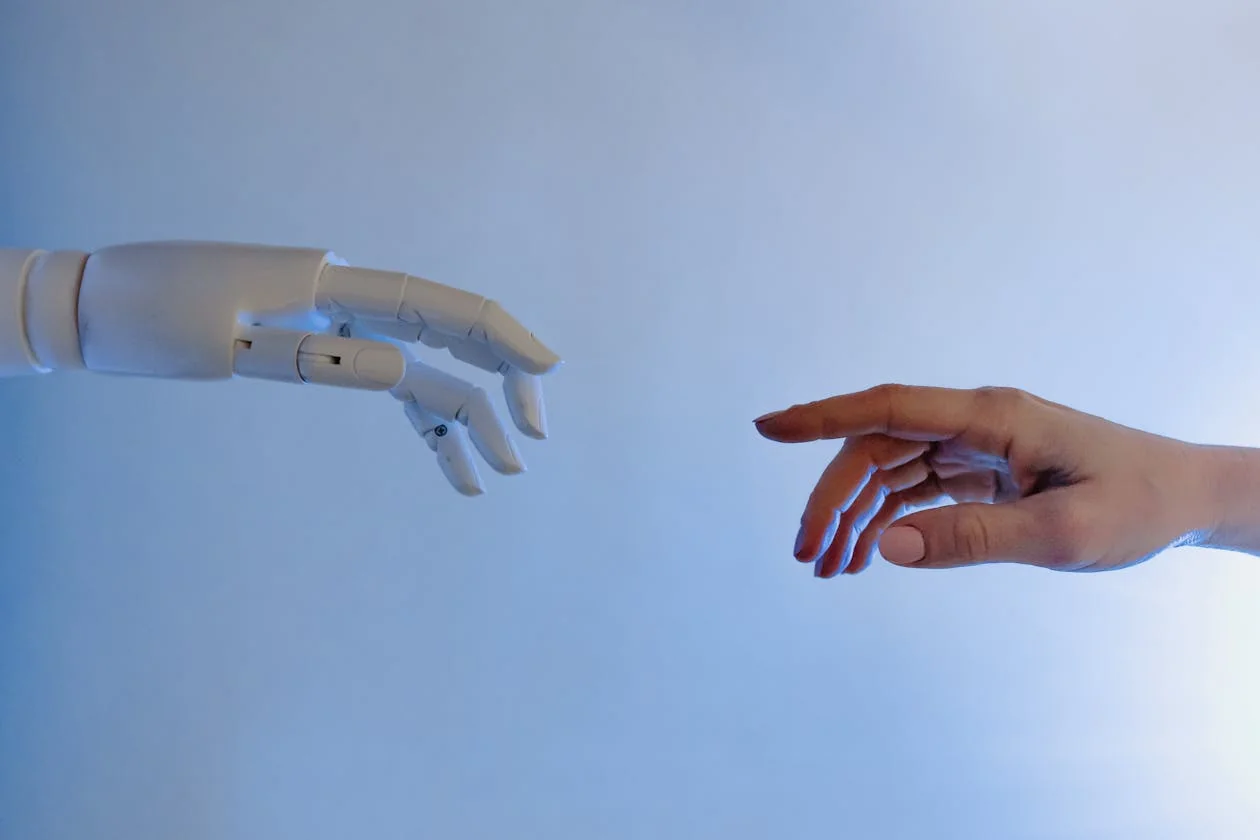 Hands carefully working on an intricate mechanical device with visible gears and springs