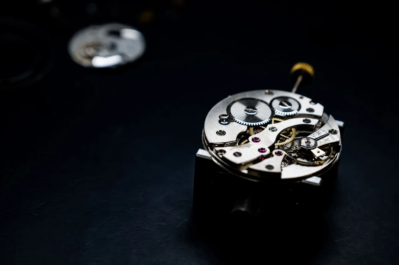 Close-up of mechanical watch gears, brass and steel