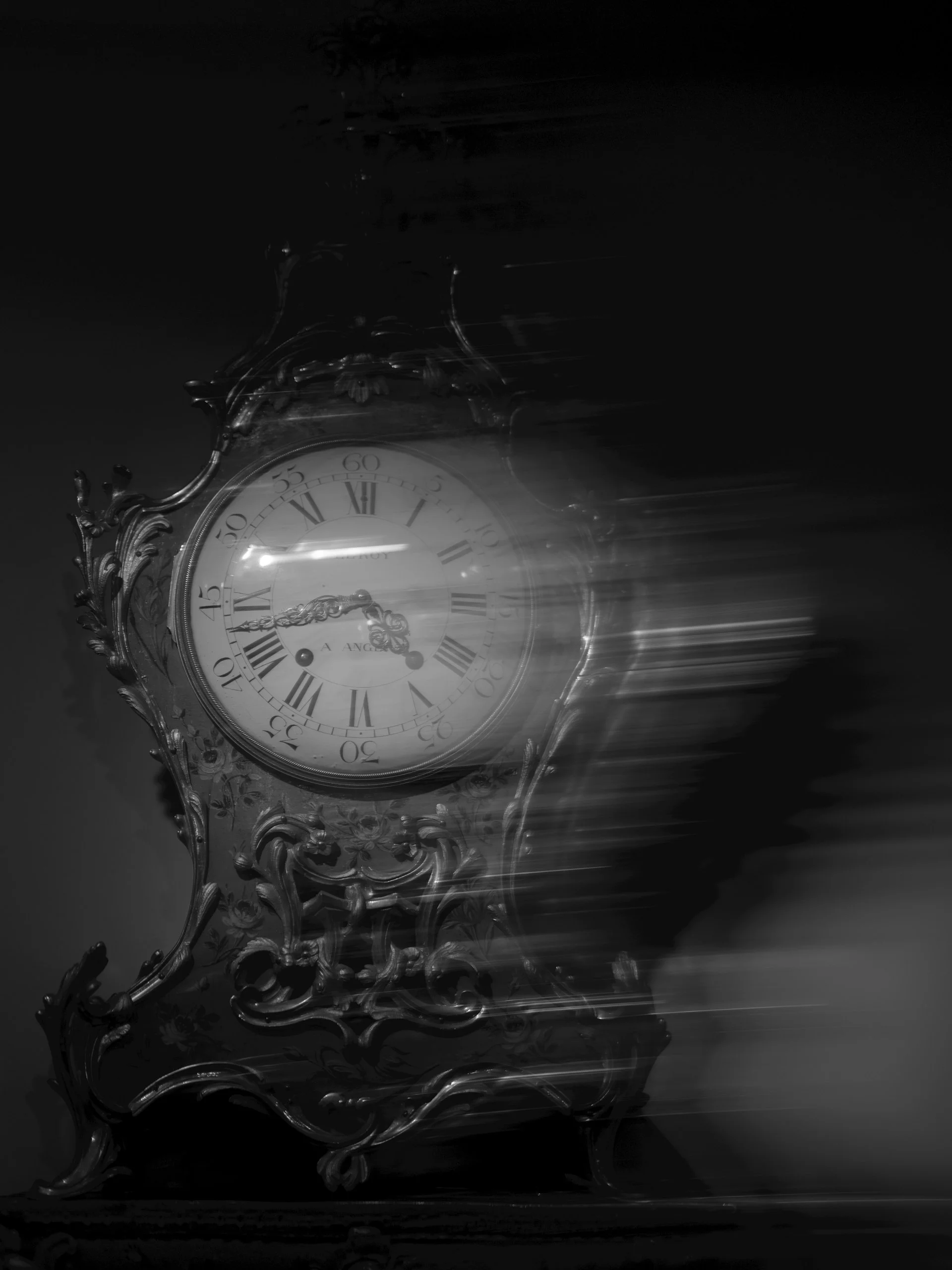 An intricate brass clock mechanism photographed in warm amber light — dozens of interlocking gears, each tooth precisely machined, the whole apparatus slightly out of focus in the foreground with the blur suggesting motion just barely stopped