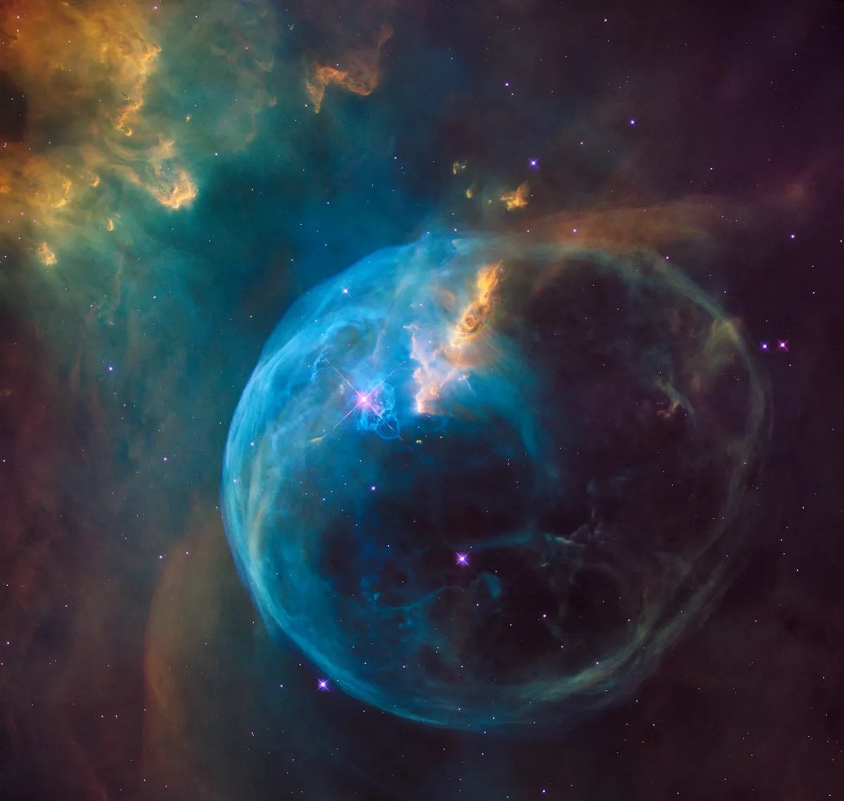Single warm light glowing in a vast dark space