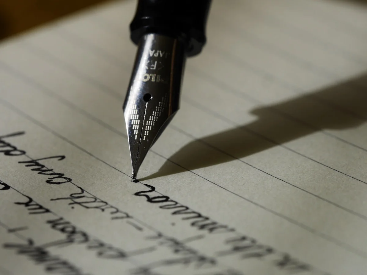 An open notebook beside a warm cup — the tools of noticing laid out on a quiet desk
