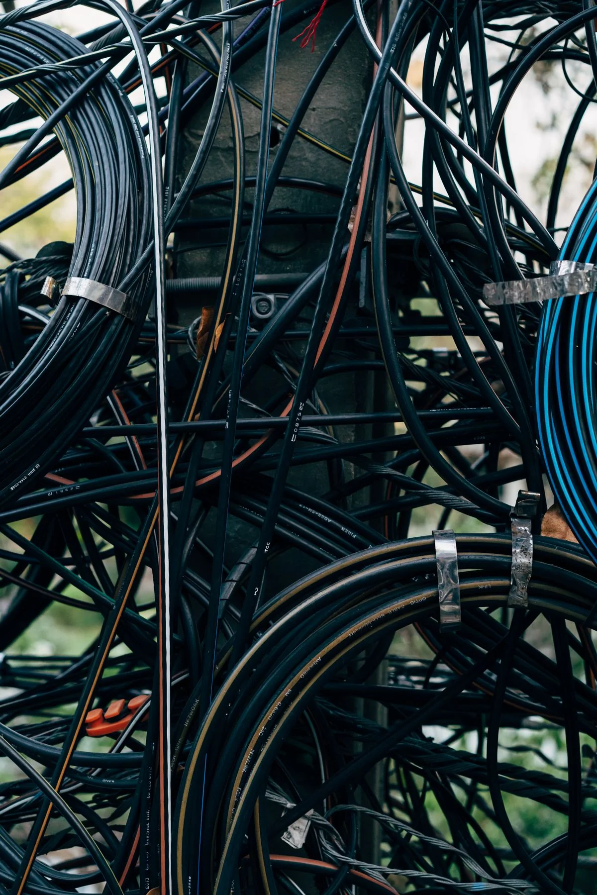 Copper telegraph cables stretching toward a distant horizon, the infrastructure of connection